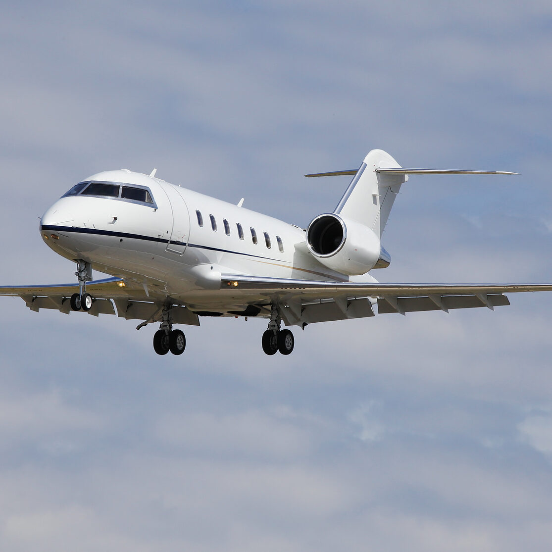 A private business jet approaching the runway